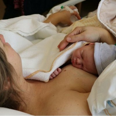 woman holding newborn baby