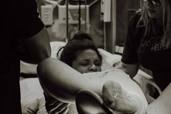 black and white photo of mom giving birth
