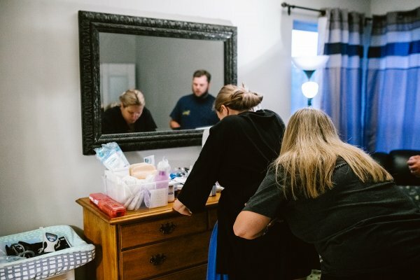 woman experiencing labor in bedroom