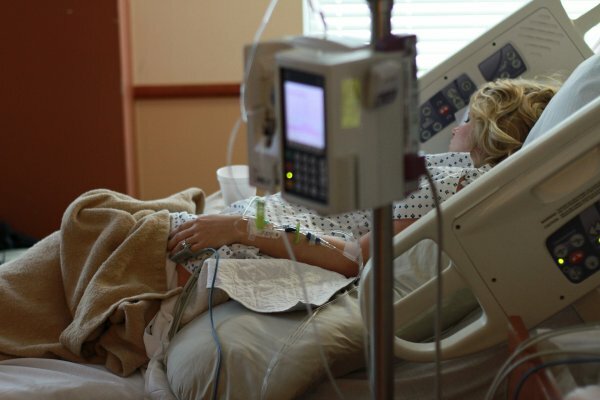 Woman laying in hospital bed