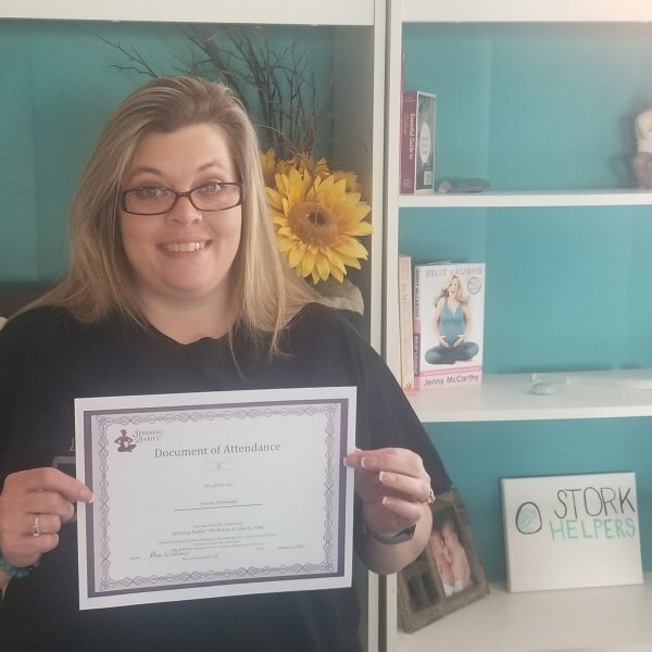 Tamara holding certificate