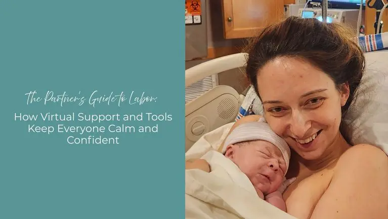 woman smiling at camera while holding newborn baby
